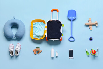 Travel accessories for children on color background