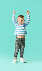 Cute little boy on color background