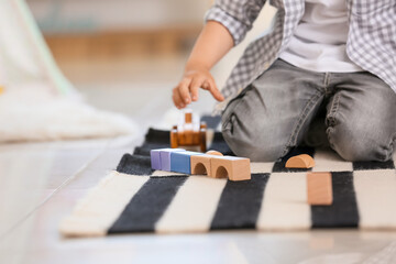 Cute little boy playing at home
