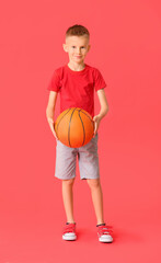 Cute little basketball player on color background