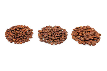 Roasted coffee beans. Three sorts of arabica isolated on white background