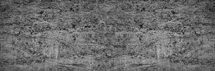 Gray abstract grunge background. Texture of old concrete wall. Wide banner with a rough grungy concrete texture for your design.