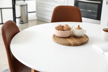 Dining table in interior of modern kitchen
