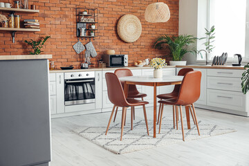 Interior of stylish modern kitchen with dining table