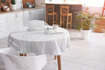 Dining table in interior of modern kitchen