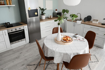 Interior of stylish modern kitchen with dining table