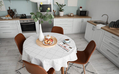 Interior of stylish modern kitchen with dining table