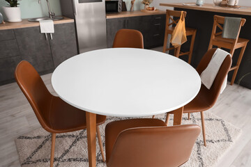 Dining table in interior of modern kitchen