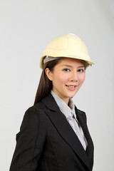 Young Asian female wearing suit safety helmet look at camera