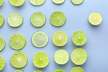 Fresh lime slices on light background