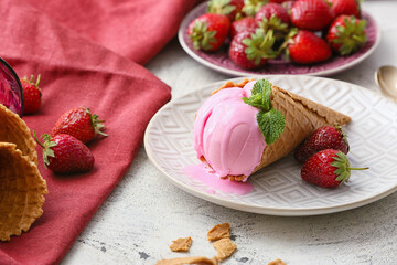 Plate with tasty strawberry ice cream on light background