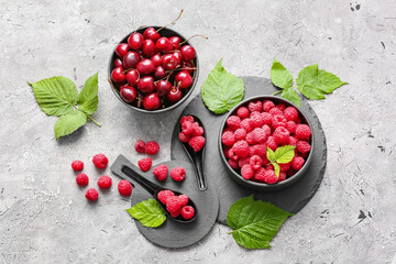 Tasty fresh berries on grey background