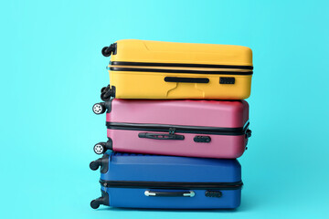 Packed suitcases on color background. Travel concept