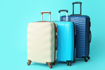 Packed suitcases on color background. Travel concept