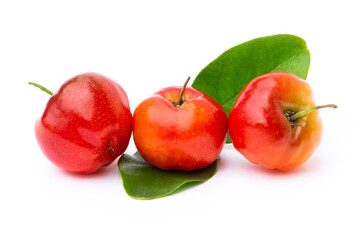 Closeup three fresh red acerola cherry fruit with green leaf isolated on white background. Macro
