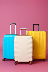 Packed suitcases on color background. Travel concept