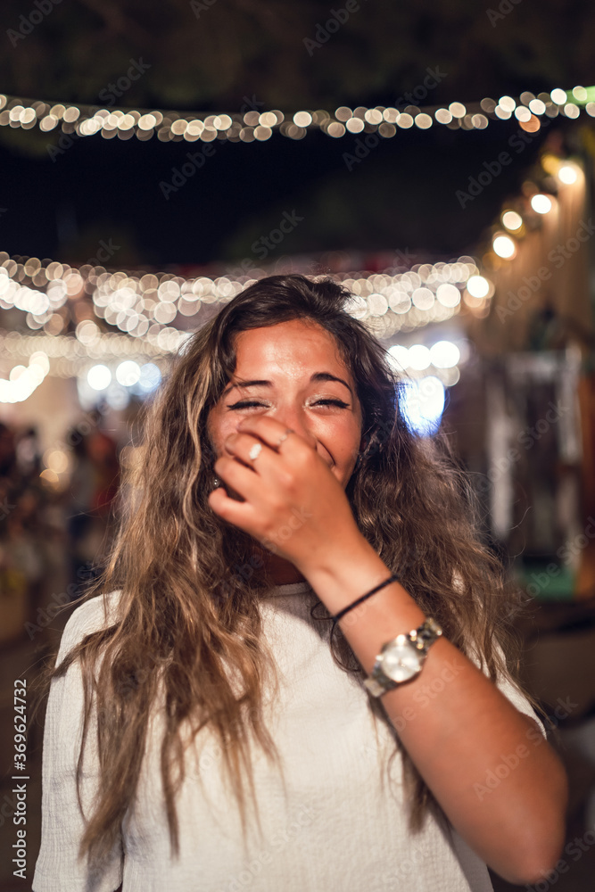 Poster Happy tanned Caucasian female at an amusement park