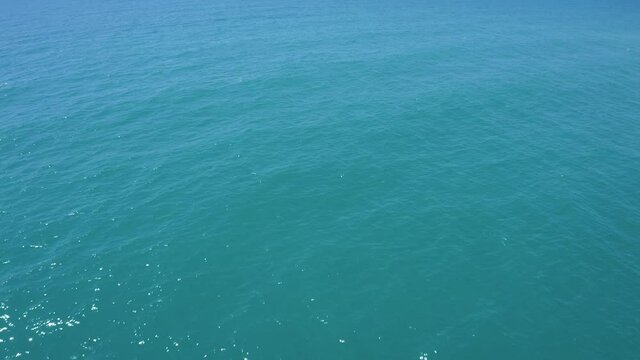 Top View Of Dark Blue Ocean Water And Surface . Aerial Drone Shot Over The Sea