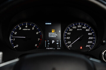Car dashboard with white  backlight: Odometer, speedometer, tachometer, fuel level, water...