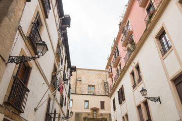 Fototapeta na wymiar Typical street in the historical old town center of San Sebastian (Donostia, Basque Autonomous Community, Spain). Beautiful architecture. 