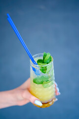 Hand holding smoothie shake cocktail. Drinking red healthy smoothie concept. Seasonal cocktail.