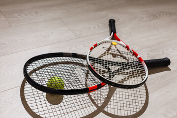 Tennis iquipment against a wooden background