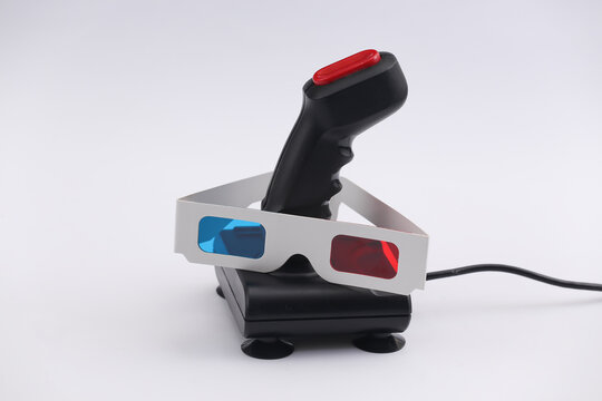 Retro joystick with 3d glasses on a white background. Attributes 80s
