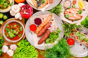 Traditional Georgian cuisine. Matzoon Okroshka, Khash Chikhirtma Harcho Soup, Dolma Chanakhi Chashululi Chkmeruli Kupati