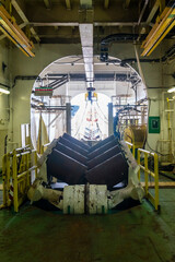 Pipelay station with pipe roller inside a pipe tunnel of a pipelay barge