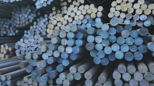 Warehouse of metal billets at the factory, round metal blank, metal blank.