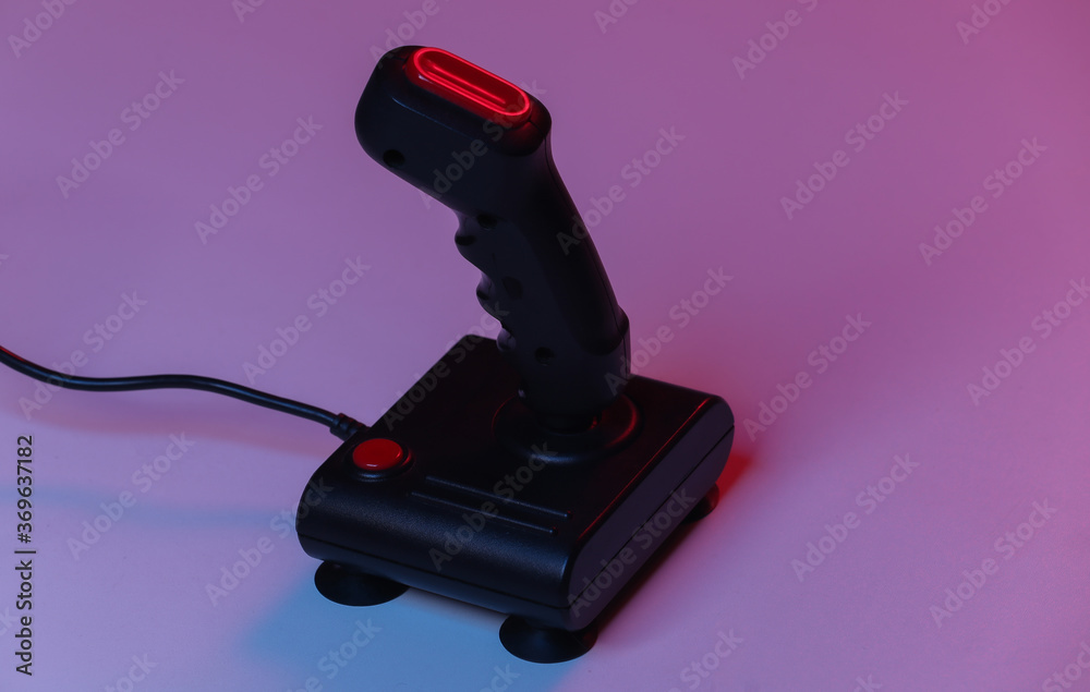 Wall mural retro joystick in red blue gradient neon light. gaming, video game competition