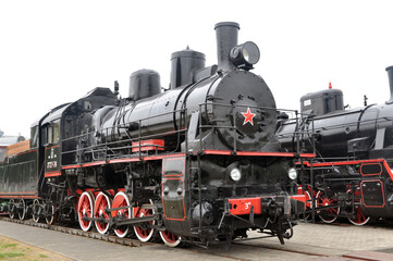Fototapeta na wymiar Soviet steam locomotive of the first half of the 19th century series Em in the Museum of Railway Engineering