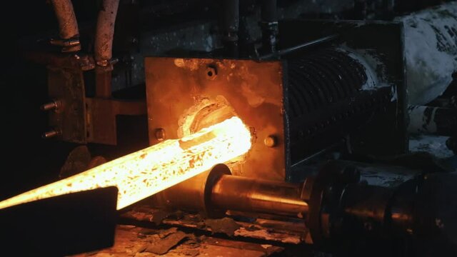 Production process at a metal rolling plant, moving on a hot metal ribbon, rolling metal in production, ball production phase,