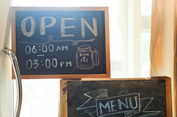 Shop opening time information on the chalkboard