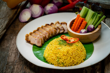 Fried Rice with Turmeric With crispy pork as a side dish