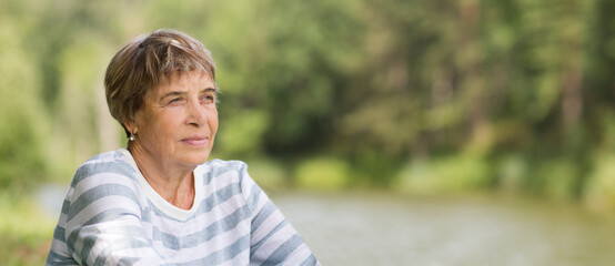 happy Senior caucasian woman relaxed  outdoors. copy space