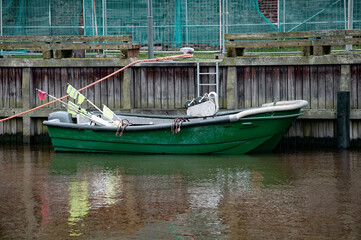 Fototapeta na wymiar Boats , tugs and motor boats at the port harbor pier.