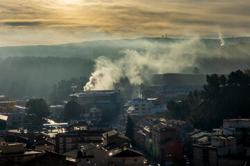Smoke from heating coming out of the roof chimneys in Teruel