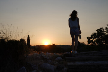 Silhouette woman at sunset