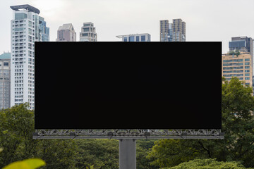 Blank black road billboard with Bangkok cityscape background at day time. Street advertising poster, mock up, 3D rendering. Front view. The concept of marketing communication to promote or sell idea.