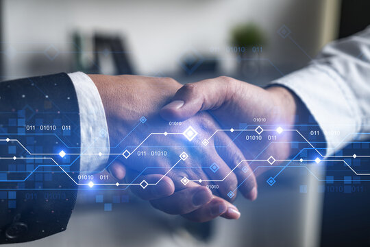 Double exposure of two businesspeople handshake and binary technology hologram drawing background. Concept of partnership and agreement. Formal wear.