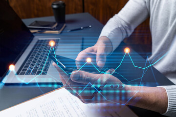 Man using phone. Hands typing smartphone. Double exposure with chart hologram. Close up. Financial graph and analysis concept. On-line research and investment.