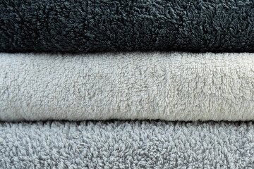 Background of the detail of a terrycloth towels in different shades of gray and white. - obrazy, fototapety, plakaty