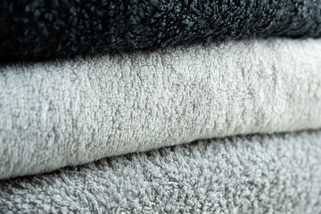 Background of the detail of a terrycloth towels in different shades of gray and white.