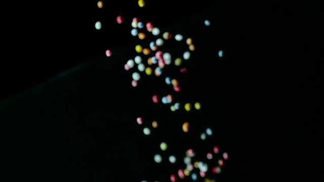 Sprinkles tumble onto surface at 2000fps