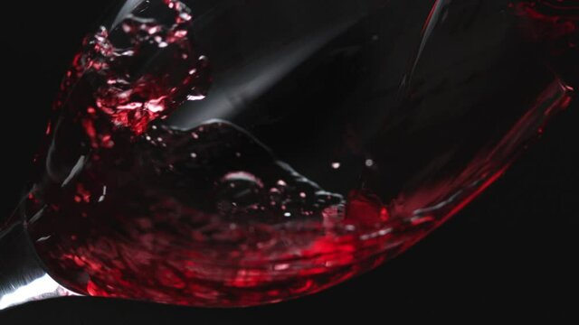 Red Wine slow motion pour into glass at 2000fps