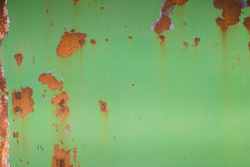 the texture of rusty tin, with already peeled and faded green paint.