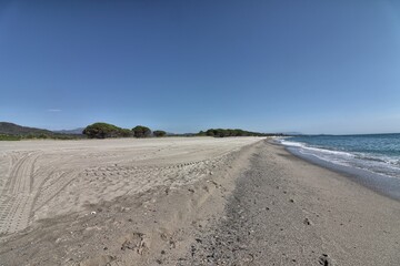 Sand and blue sea in Perdepera beach. Sardinia, Italy