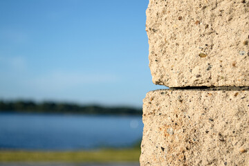 Old stone wall with blue sky, blurred background, copy space