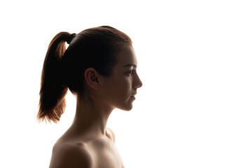 Silhouette portrait. Natural beauty. Woman sideways isolated on white. Skin and body care...